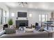 Bright living room features a decorative fireplace, sleek furnishings, and an open-concept design at 3105 N Elizabeth St, Denver, CO 80205