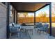 Outdoor patio with a modern seating area and shaded pergola at 3105 N Elizabeth St, Denver, CO 80205