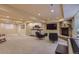 Large finished basement includes a wet bar, fireplace, and entertainment area at 1604 Brookside Dr, Highlands Ranch, CO 80126