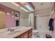This bathroom features a single sink, a bathtub with shower, and a tile surround at 1604 Brookside Dr, Highlands Ranch, CO 80126
