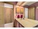 Bathroom with double sinks, a large mirror and wood cabinets and large closet at 1604 Brookside Dr, Highlands Ranch, CO 80126
