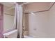 Bathroom showcasing bathtub and shower with tile surround and shower curtain at 1604 Brookside Dr, Highlands Ranch, CO 80126