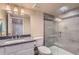 Bathroom features a walk-in shower with gray and white marbled tile, and granite countertops at 1604 Brookside Dr, Highlands Ranch, CO 80126