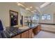Spacious bathroom featuring double sinks, large mirror, soaking tub, and a walk-in shower at 1604 Brookside Dr, Highlands Ranch, CO 80126