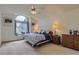 Cozy bedroom with large window, plush carpeting, and ample natural light at 1604 Brookside Dr, Highlands Ranch, CO 80126