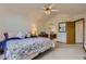 Comfortable bedroom with neutral tones, a ceiling fan, and an ensuite bathroom at 1604 Brookside Dr, Highlands Ranch, CO 80126