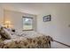 Inviting bedroom with a view of the backyard at 1604 Brookside Dr, Highlands Ranch, CO 80126
