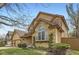 Charming home with a blend of brick and siding, complemented by lush landscaping at 1604 Brookside Dr, Highlands Ranch, CO 80126