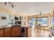 Open kitchen with a view of the living room and access to the backyard deck at 1604 Brookside Dr, Highlands Ranch, CO 80126