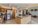 Modern kitchen with stainless steel appliances and a granite-topped island and breakfast bar at 1604 Brookside Dr, Highlands Ranch, CO 80126