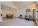 Open-concept living area with dining set and desk area for easy living and entertaining at 1604 Brookside Dr, Highlands Ranch, CO 80126