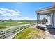 A view of the back yard with patio, fence, landscaping, and golf course at 401 Clubhouse Dr, Fort Lupton, CO 80621