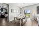 Dining room with view to backyard and access to the Primary bedroom at 401 Clubhouse Dr, Fort Lupton, CO 80621