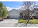 Charming single Gathering home with a two car garage, landscaped yard, and covered front porch at 401 Clubhouse Dr, Fort Lupton, CO 80621