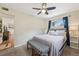 Bedroom featuring a ceiling fan, neutral walls, and a doorway to the hallway at 9150 Fir Dr, Thornton, CO 80229