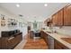 An open kitchen floor plan with stainless appliances, wood cabinets, and an eat-in area at 9150 Fir Dr, Thornton, CO 80229