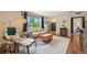 Bright living room with modern furnishings, stylish rug, and plenty of natural light at 9150 Fir Dr, Thornton, CO 80229