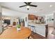View of dining area and living space, with granite kitchen island at 9150 Fir Dr, Thornton, CO 80229