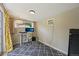 Cozy office space with a patterned rug, white desk, and plenty of natural light at 9150 Fir Dr, Thornton, CO 80229