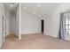Spacious bedroom with carpeted floors and plenty of natural light from the window at 2 Fieldstone Trl, Englewood, CO 80113