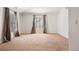 Bright, open bedroom with large windows, neutral carpet and fresh white walls at 2 Fieldstone Trl, Englewood, CO 80113