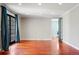 Spacious room with hardwood floors and French doors to the exterior at 2 Fieldstone Trl, Englewood, CO 80113