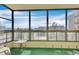 Relaxing enclosed balcony with comfortable seating and stunning views of the cityscape at 13931 E Marina Dr # 402, Aurora, CO 80014