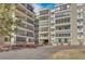 Multi-story condo building with balconies and well maintained landscaping at 13931 E Marina Dr # 402, Aurora, CO 80014