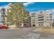 Well-maintained condo building with mature trees, landscaping and a handicap parking spot at 13931 E Marina Dr # 402, Aurora, CO 80014