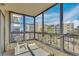 Enclosed patio with large windows that offer neighborhood views and ample sunlight at 13931 E Marina Dr # 402, Aurora, CO 80014