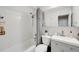 Bright bathroom featuring a shower-tub combination with white subway tile and modern fixtures at 85 N Ogden St # 34, Denver, CO 80218