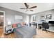 Comfortable bedroom featuring hardwood floors, a ceiling fan, and a dedicated workspace at 85 N Ogden St # 34, Denver, CO 80218