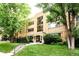 Attractive brick apartment building with well-maintained lawn and landscaping at 85 N Ogden St # 34, Denver, CO 80218