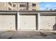 Garage parking with several closed garage doors at 85 N Ogden St # 34, Denver, CO 80218