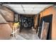 A cluttered garage with overhead door, shelving and lots of room for storage and outdoor recreation equipment at 85 N Ogden St # 34, Denver, CO 80218