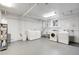 Common laundry area with several washers and dryers, a utility sink and overhead lighting in a spacious room at 85 N Ogden St # 34, Denver, CO 80218