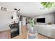 Open floor plan featuring a dining table, modern lighting, and a view into the living room at 85 N Ogden St # 34, Denver, CO 80218