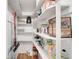 Walk-in pantry with shelving, storage, and various food items at 85 N Ogden St # 34, Denver, CO 80218