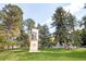A monument in a park-like setting, with mature trees, lush green grass, blue skies, and a glimpse of nearby buildings at 85 N Ogden St # 34, Denver, CO 80218