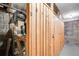 This is a common storage area with separate wood-slat storage lockers. It has chain-link fencing above each locker at 85 N Ogden St # 34, Denver, CO 80218