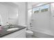 Bright white bathroom featuring bath tub with shower at 864 Clover Loop, Erie, CO 80026