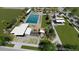 Rendering of a modern community pool, playground, seating, and picnic area surrounded by greenery at 864 Clover Loop, Erie, CO 80026