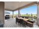 Spacious covered deck with dining area, BBQ grill and scenic outdoor views at 864 Clover Loop, Erie, CO 80026