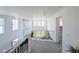 Hallway has neutral carpet, white walls and black bannister at 864 Clover Loop, Erie, CO 80026