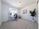 Well-lit home office with a large window, modern desk, and comfortable chair at 864 Clover Loop, Erie, CO 80026