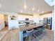 Modern kitchen featuring a large center island with seating, stainless steel appliances, and ample counter space at 864 Clover Loop, Erie, CO 80026