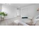 Bright and airy living area with plush seating, neutral decor, and a view of the hallway at 864 Clover Loop, Erie, CO 80026