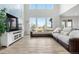 Bright living room with high ceilings, large windows, and a comfortable sectional sofa, perfect for relaxation at 864 Clover Loop, Erie, CO 80026