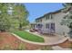 Expansive backyard featuring lush lawn, a trampoline, and an outdoor seating area at 877 Eldorado Dr, Superior, CO 80027