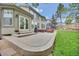 Spacious backyard features a stone patio with outdoor seating and a well-maintained lawn at 877 Eldorado Dr, Superior, CO 80027